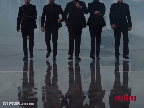 A Poster For The Movie Blood Brothers Shows A Group Of Men Standing Next To Each Other GIF
