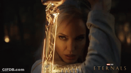 A Poster For The Movie Eternals Shows A Woman GIF