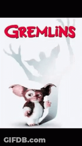 Gizmo Holding Paper Gremlins Poster GIF