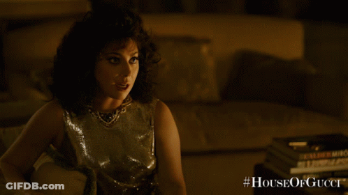 A Poster For The Movie House Of Gucci Shows A Woman GIF
