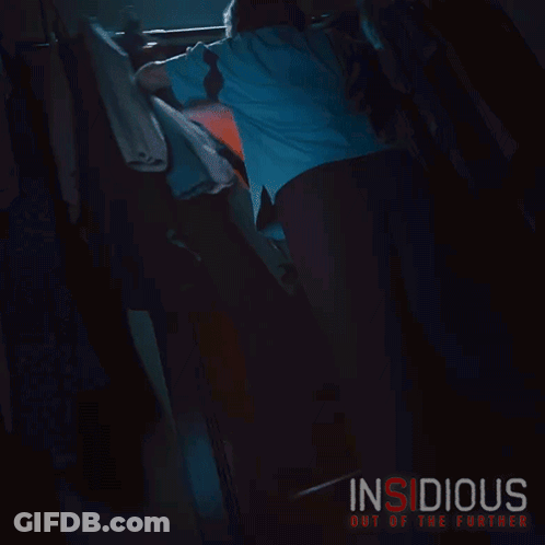 A Poster For The Movie Insidious Out Of The Further Shows A Man Reaching For A Door GIF