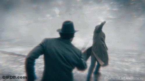 A Poster For The Movie Secrets Of Dumbledore Shows A Man And Woman GIF