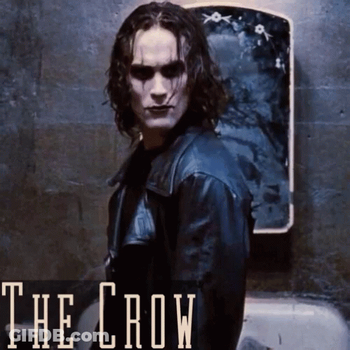 A Poster For The Movie The Crow With A Man In A Leather Jacket Standing In Front Of A Mirror GIF