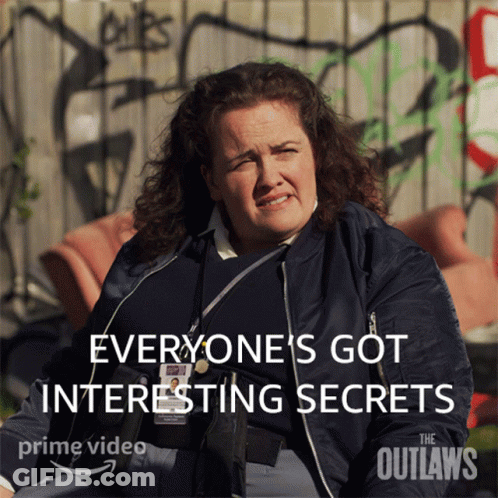 A Poster For The Outlaws Shows A Woman Sitting In Front Of A Graffiti Covered Wall GIF