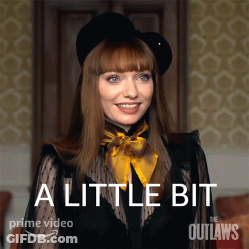 A Poster For The Outlaws Shows A Woman Wearing A Black Hat And A Black Top GIF