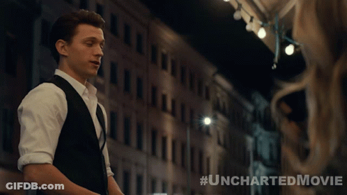 A Poster For The Uncharted Movie Shows A Man In A Suit And Vest GIF