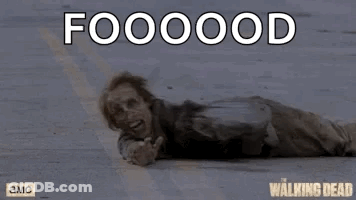 A Poster For The Walking Dead Shows A Zombie Laying On The Ground .. GIF