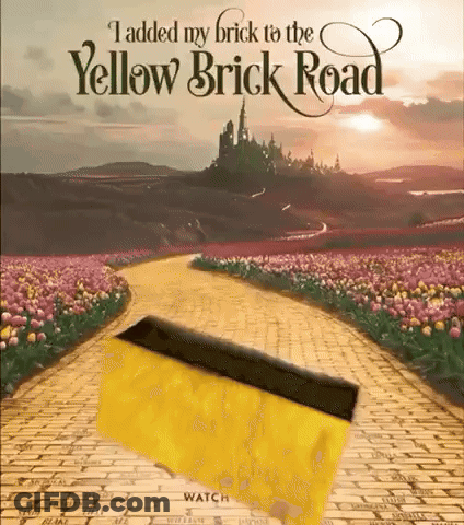 A Poster For The Yellow Brick Road With A Yellow Brick In The Middle GIF