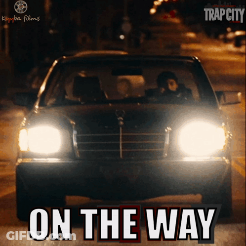 A Poster For Trap City Shows A Car Driving Down The Street GIF