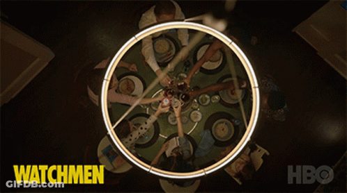 A Poster For Watchmen Shows A Group Of People Sitting Around A Circular Table GIF
