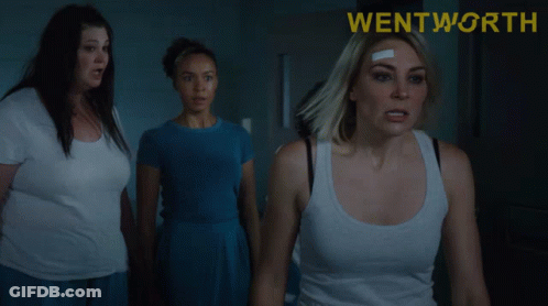 A Poster For Wentworth Shows A Woman With A Bandage On Her Forehead GIF