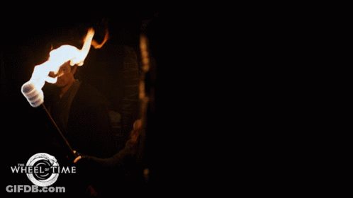 A Poster For Wheel Of Time Shows A Group Of People Walking Through A Dark Tunnel GIF