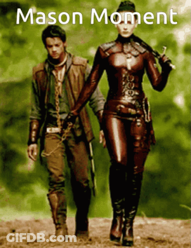 A Poster Of A Man And A Woman Holding Hands With The Words Mason Moment Written Above Them GIF