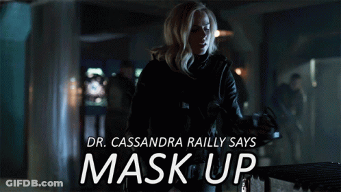 A Poster Of A Woman Wearing A Gas Mask With The Words " Dr. Cassandra Railly Says Mask Up " GIF