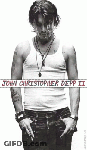 A Poster Of John Christopher Depp Ii With His Hands In His Pockets GIF