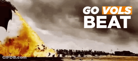 A Poster That Says Go Vols Beat With A Fire Coming Out Of A Dragon 'S Mouth GIF