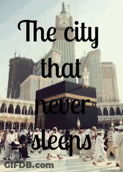A Poster That Says The City That Never Sleeps With A Clock Tower In The Background GIF