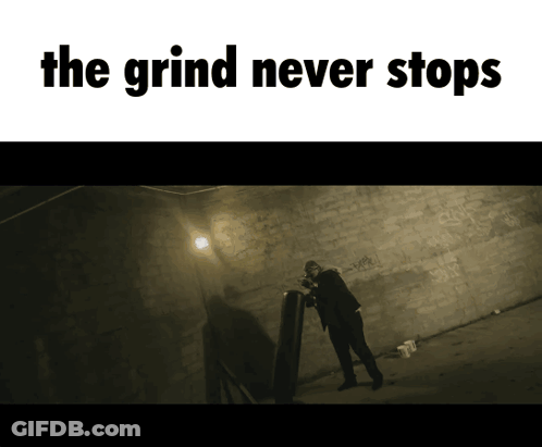 A Poster That Says The Grind Never Stops With A Man Standing In A Dark Room GIF