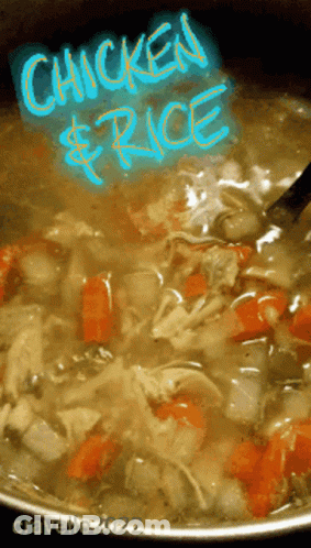 A Pot Of Chicken And Rice Soup With A Spoon GIF
