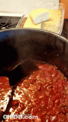 A Pot Of Chili Is Being Stirred By A Black Spoon And The Photo Was Taken By Cravello222 GIF