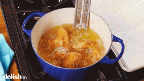 A Pot Of Food Is Being Cooked On A Stove And The Word Delish Is On The Bottom Right GIF