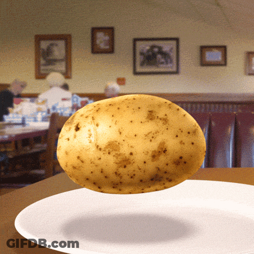 A Potato Is Floating On A White Plate GIF