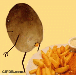 A Potato With Arms And Legs Is Standing Next To A Plate Of French Fries .. GIF