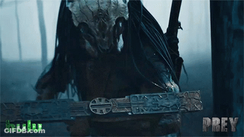 A Predator Is Holding A Sword With The Word Prey On The Bottom GIF