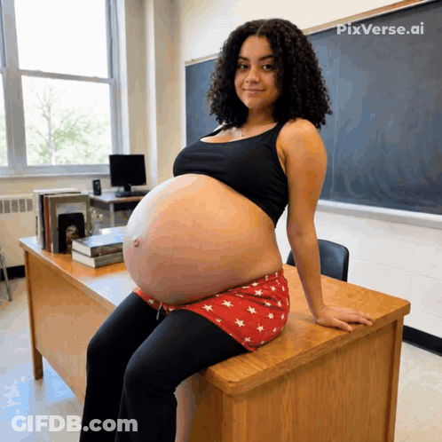 A Pregnant Woman Is Sitting On A Desk With Pixverse.ai Written On The Bottom GIF