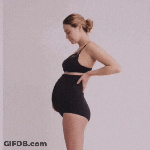 A Pregnant Woman Is Wearing A Black Bra And Black Underwear GIF