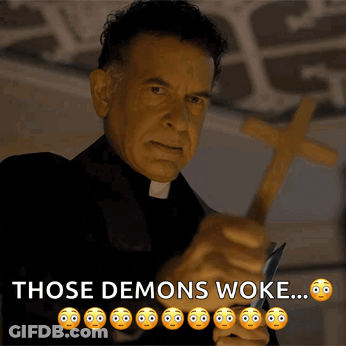 A Priest Holding A Cross And A Knife With The Words Those Demons Woke Below Him GIF