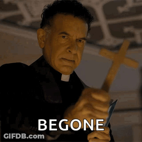 A Priest Is Holding A Cross And The Word Begone Is On The Bottom GIF