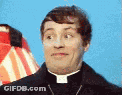 A Priest Is Making A Funny Face In Front Of A Striped Umbrella GIF