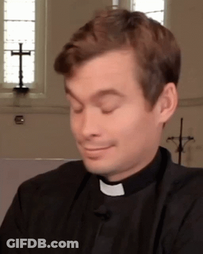 A Priest Making A Funny Face With His Eyes Closed In Front Of A Cross GIF