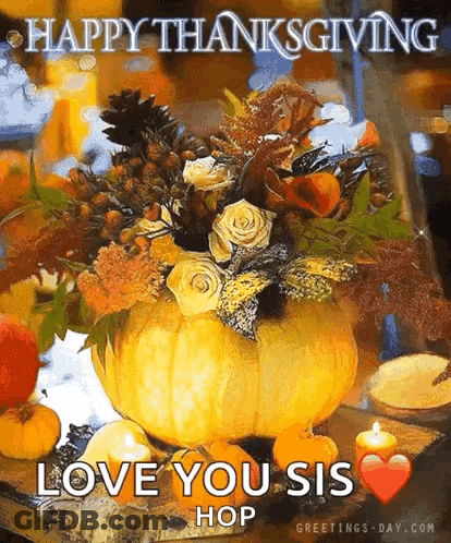A Pumpkin Filled With Flowers And Candles On A Table . GIF