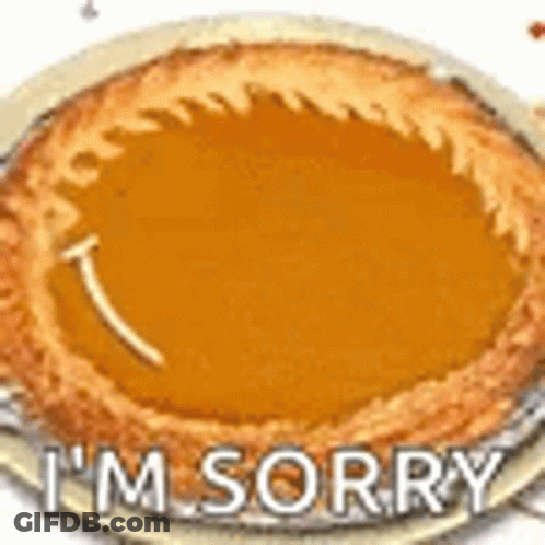 A Pumpkin Pie With The Words `` I 'M Sorry '' Written On It . GIF