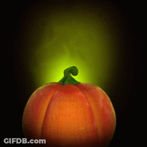 A Pumpkin With A Green Stem And A Yellow Light Behind It GIF