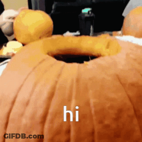 A Pumpkin With A Hole In It And The Word Hi Written On It GIF