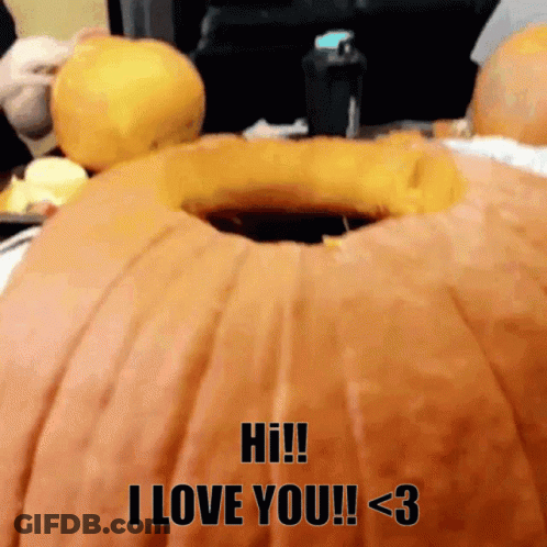 A Pumpkin With A Hole In It That Says Hi I Love You GIF