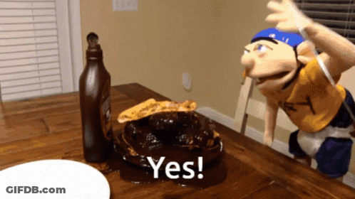 A Puppet Is Sitting At A Table With A Plate Of Food And A Bottle Of Ketchup And The Words Yes On The Table GIF