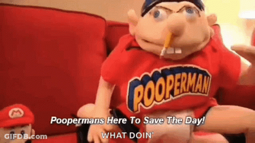 A Puppet Is Sitting On A Couch With A Pencil In His Mouth And A Red Shirt On . GIF