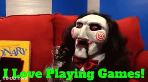 A Puppet Is Sitting On A Red Couch With The Words I Love Playing Games Behind Him GIF