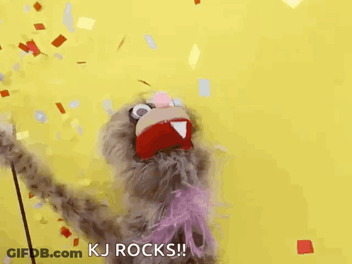 A Puppet Is Standing In Front Of A Yellow Background And Confetti Is Falling Around It . GIF