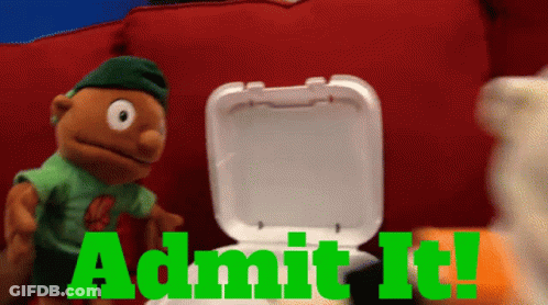 A Puppet Is Standing Next To A Styrofoam Container That Says Admit It In Green Letters GIF
