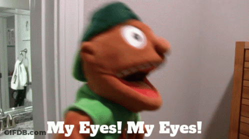 A Puppet Says " My Eyes My Eyes " While Wearing A Green Hat GIF