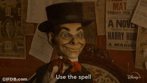 A Puppet Says Use The Spell In Front Of A Wall With Posters GIF