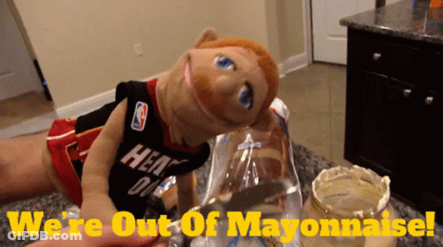 A Puppet Wearing A Heat Jersey Is Holding A Bag Of Bread GIF