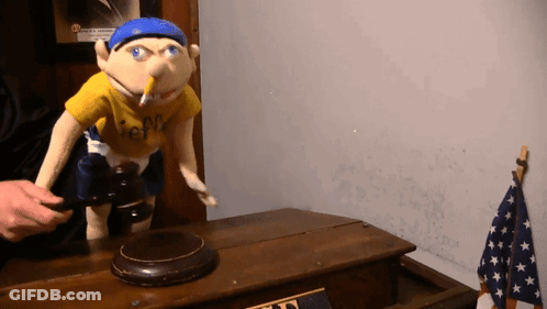 A Puppet Wearing A Yellow Shirt That Says Jeff GIF