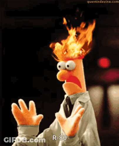 A Puppet With Flames Coming Out Of His Head Says " R-80 " GIF