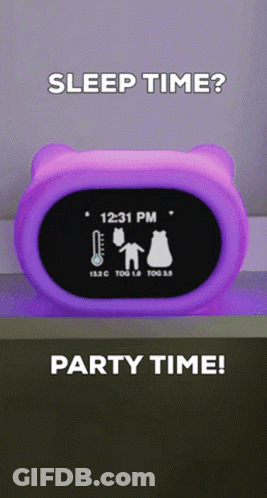 A Purple Alarm Clock Shows The Time As 12:31 Pm GIF